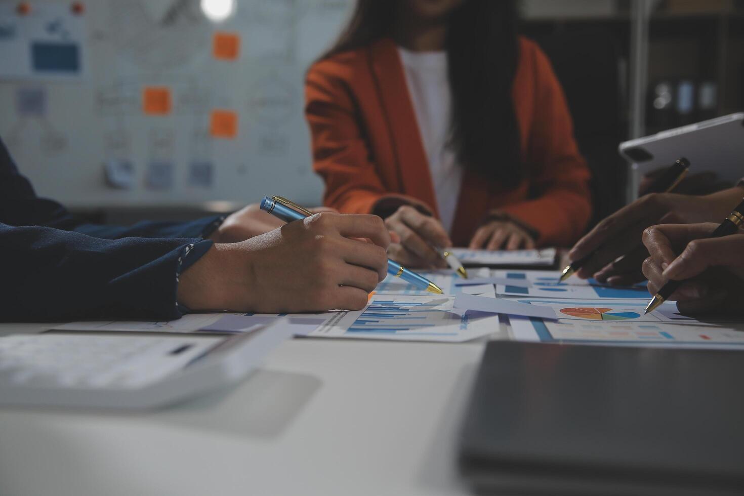 Business team collaboration discussing working analyzing with financial data and marketing growth report graph in team, presentation and brainstorming to strategy planning making profit of company. photo