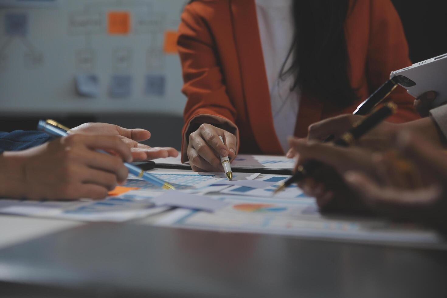 Business team collaboration discussing working analyzing with financial data and marketing growth report graph in team, presentation and brainstorming to strategy planning making profit of company. photo