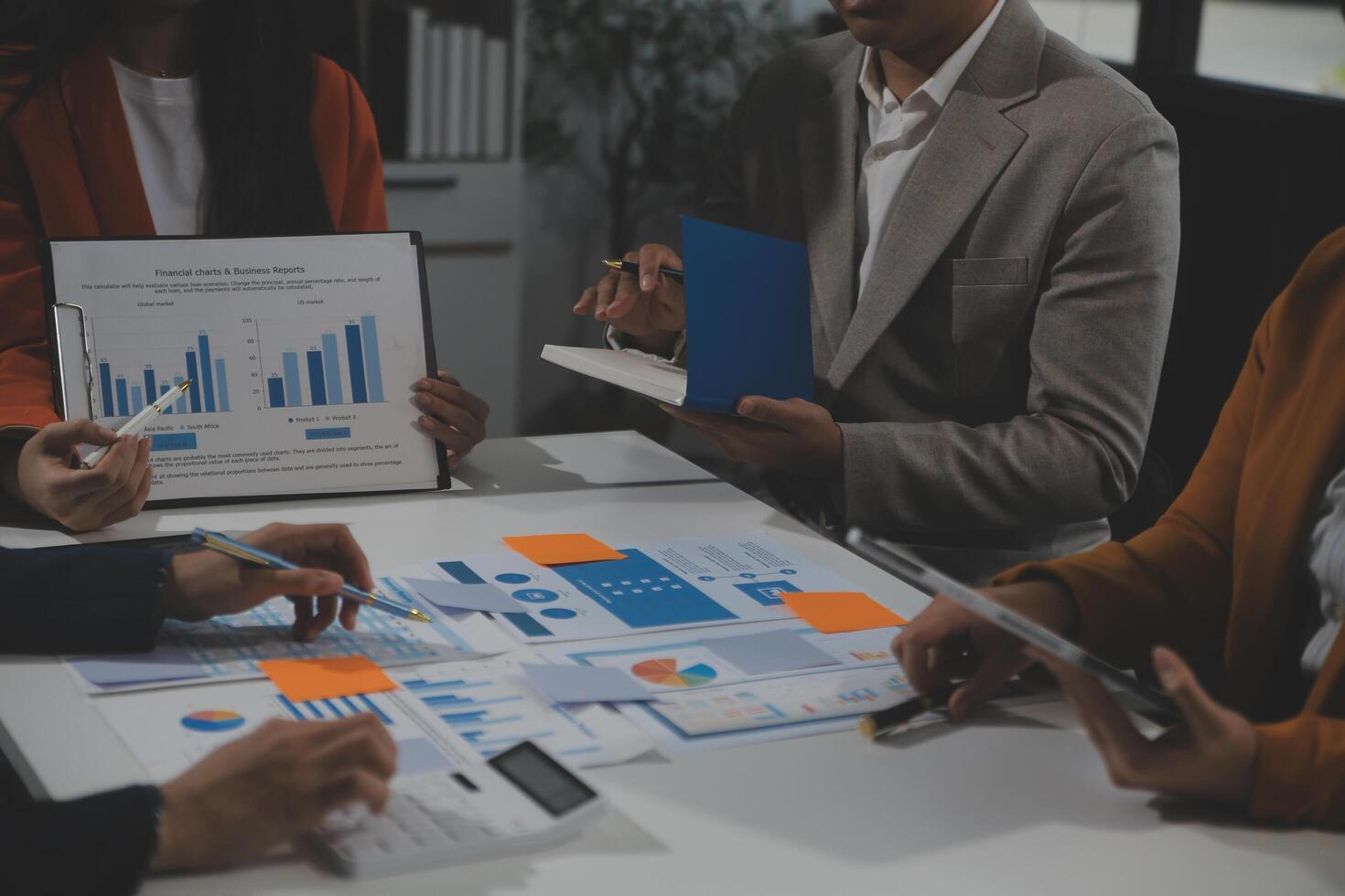 Business team collaboration discussing working analyzing with financial data and marketing growth report graph in team, presentation and brainstorming to strategy planning making profit of company. photo