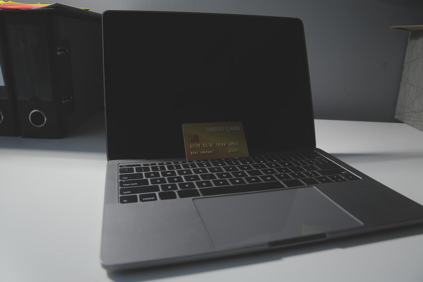Calculator on a dark background, plastic cards and banknotes photo