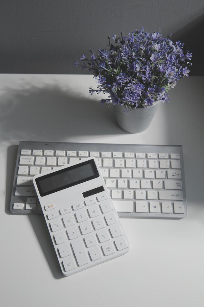 Business Architectural project, pair of compasses, glasses, rulers and calculator photo