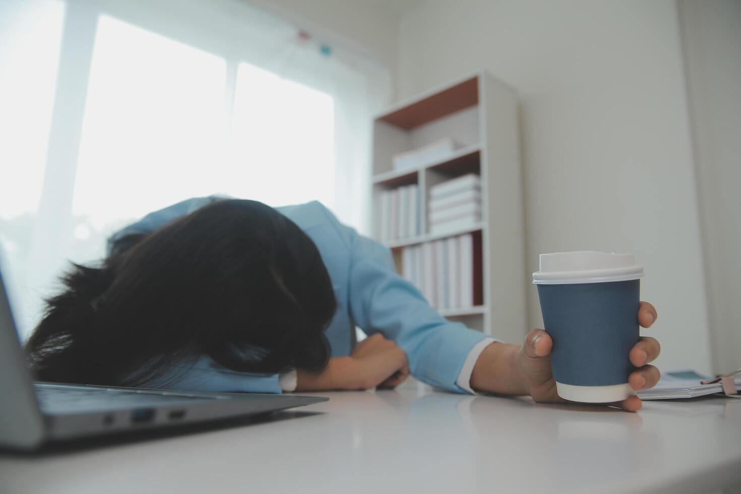 Tired teen girl rubbing dry irritable eyes feel eye strain tension migraine after computer work, exhausted young Asian woman student relieving headache pain, bad weak blurry vision, eyesight problem photo