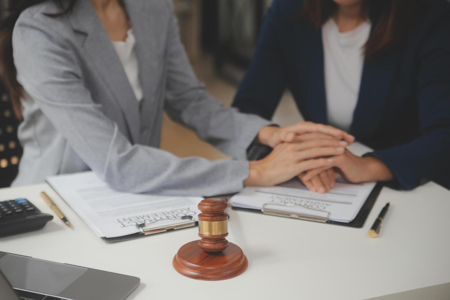 Lawyer, legal advisor, businessman brainstorming information on agreement details Business contracts in legal processing books for accuracy in contract documents. joint financial investment. photo