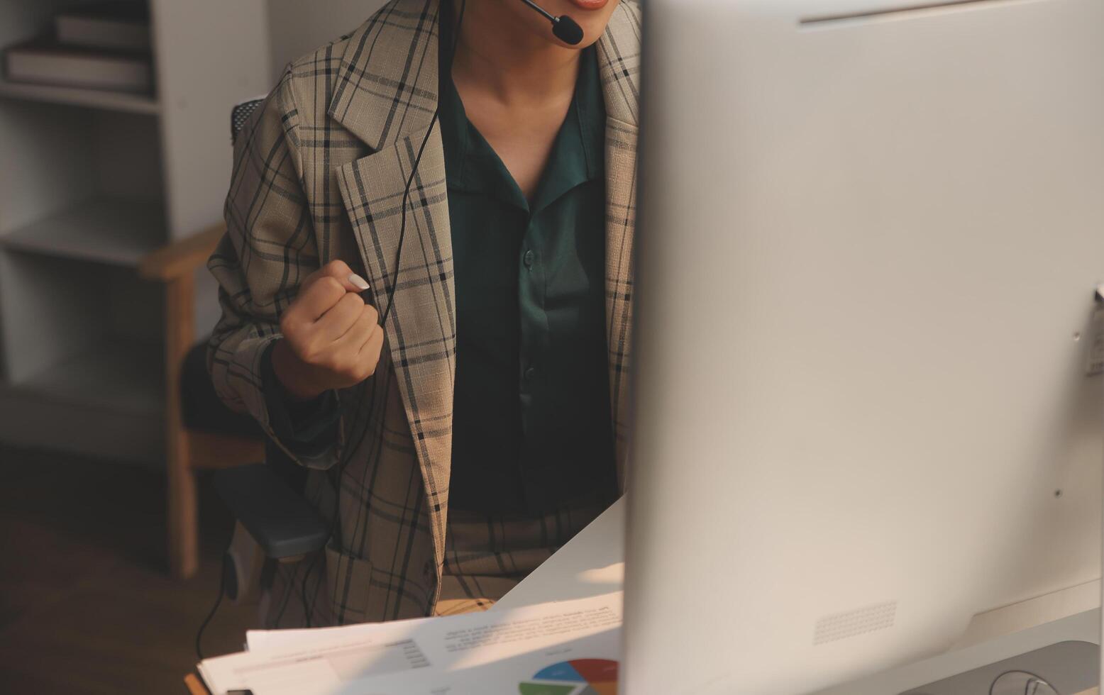 Call center, computer and business with woman in office for customer service, technical support and advice. Technology, contact us and communication with employee operator in help desk agency photo