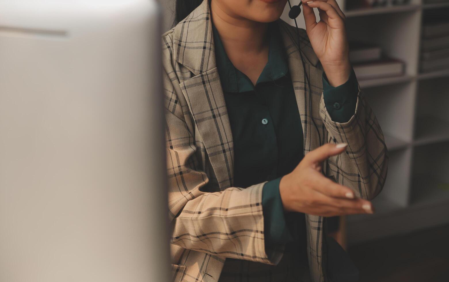 Call center, computer and business with woman in office for customer service, technical support and advice. Technology, contact us and communication with employee operator in help desk agency photo