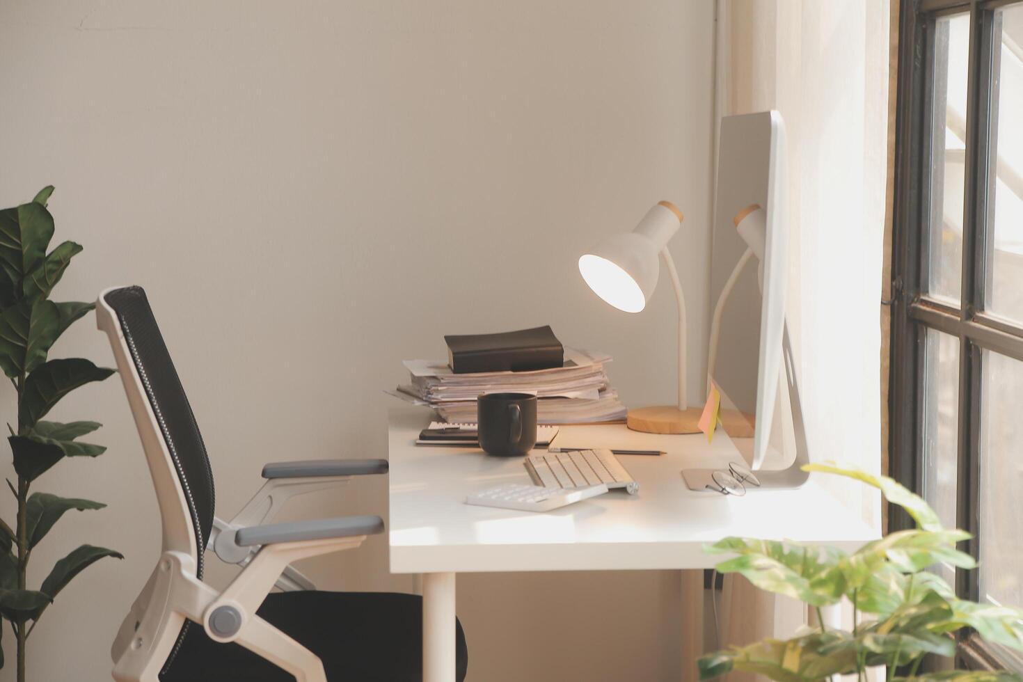 messy office workspace. Messy and cluttered office desk. Messy business office with piles of files and disorganized clutter. photo