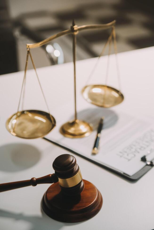 Lawyer, legal advisor, businessman brainstorming information on agreement details Business contracts in legal processing books for accuracy in contract documents. joint financial investment. photo