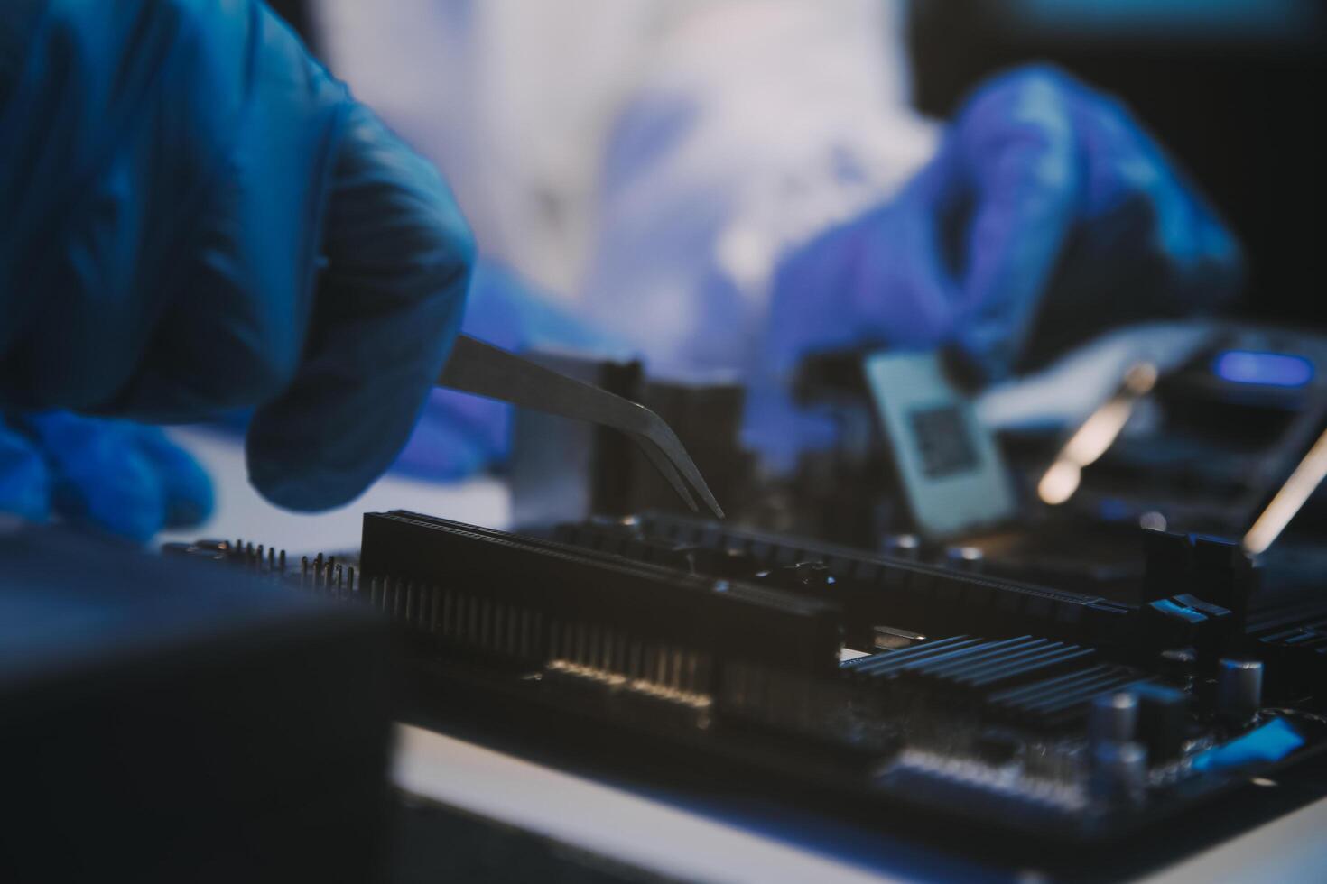 Close up of Technician measuring voltage electronic circuit board television, Service after sale fix electric equipment within insurance. photo