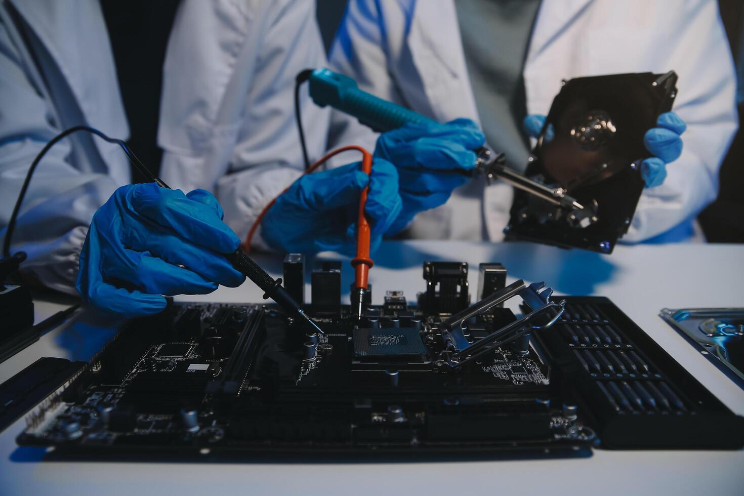 Close up of Technician measuring voltage electronic circuit board television, Service after sale fix electric equipment within insurance. photo