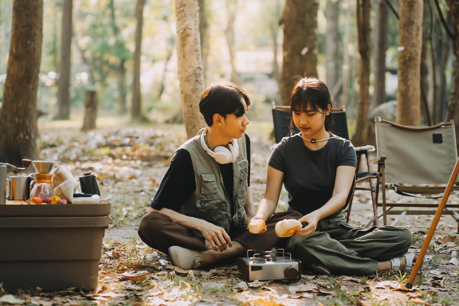 Asian couple sweet in tent inside on they camping trip, traveller relax and sleep togather in out door and camping trip photo