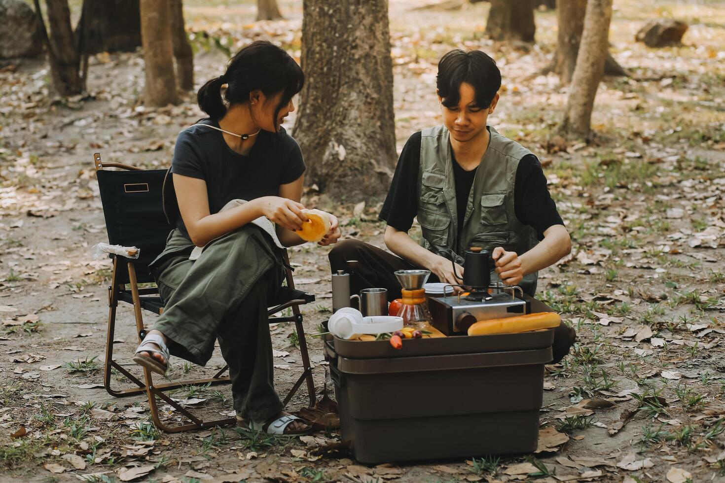 Asian couple sweet in tent inside on they camping trip, traveller relax and sleep togather in out door and camping trip photo