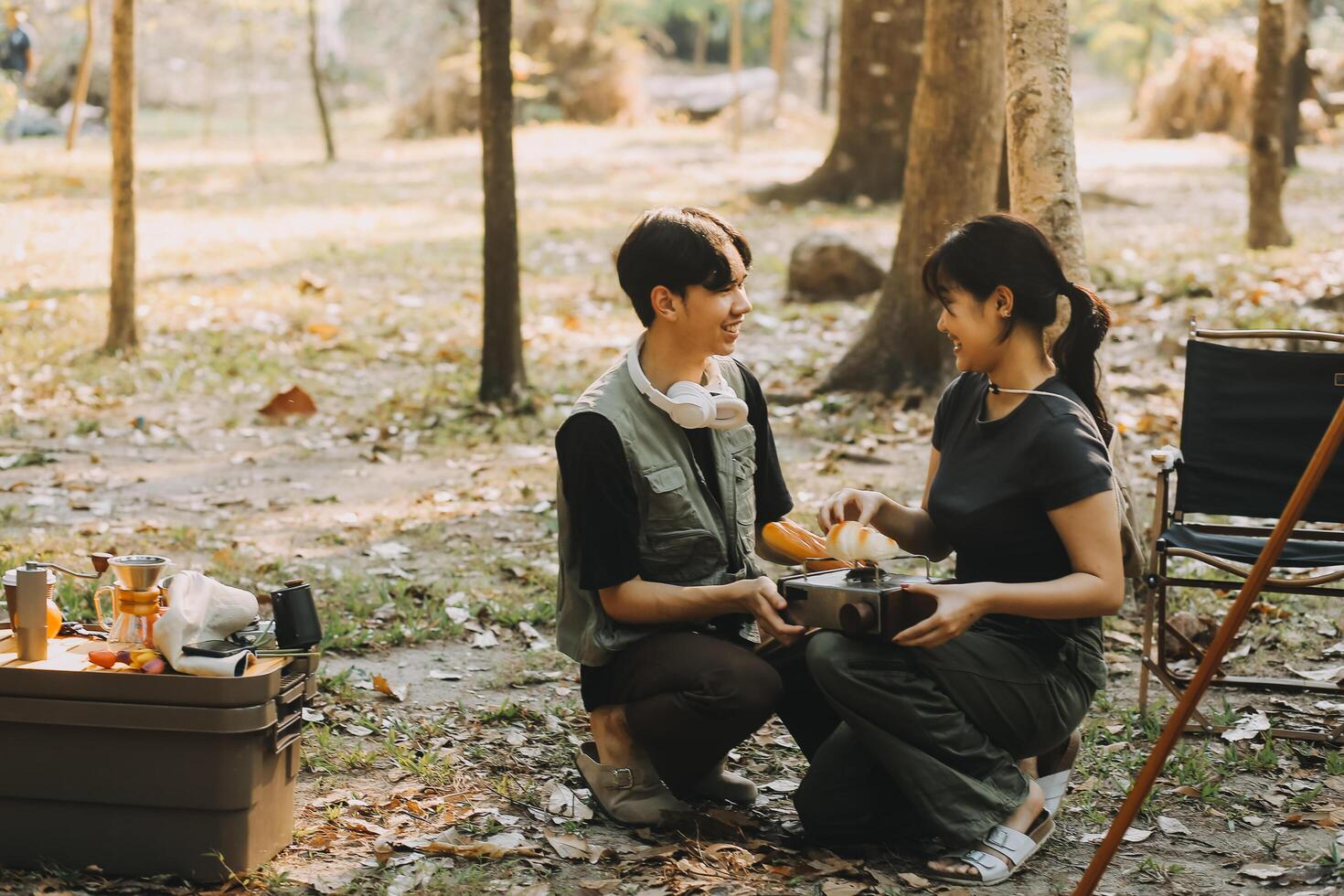 Asian couple sweet in tent inside on they camping trip, traveller relax and sleep togather in out door and camping trip photo