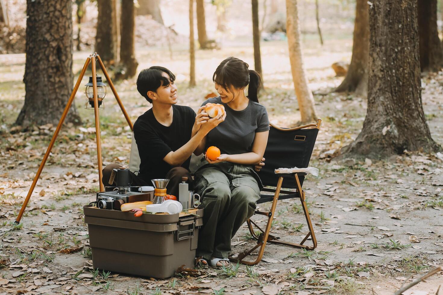 Asian couple sweet in tent inside on they camping trip, traveller relax and sleep togather in out door and camping trip photo