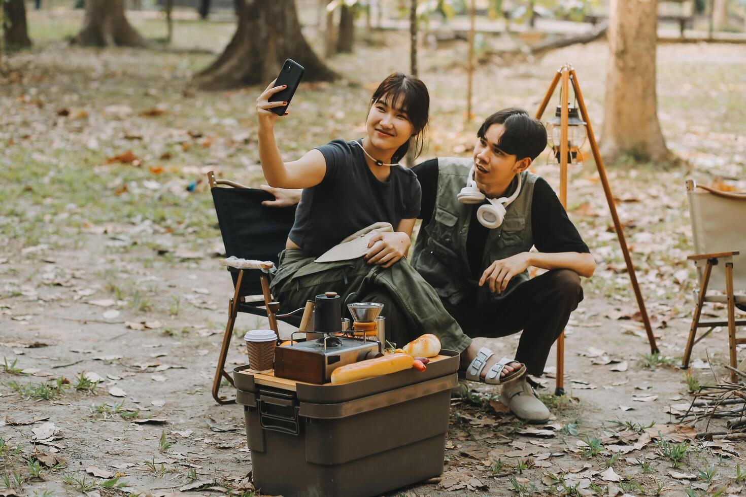 Asian couple sweet in tent inside on they camping trip, traveller relax and sleep togather in out door and camping trip photo