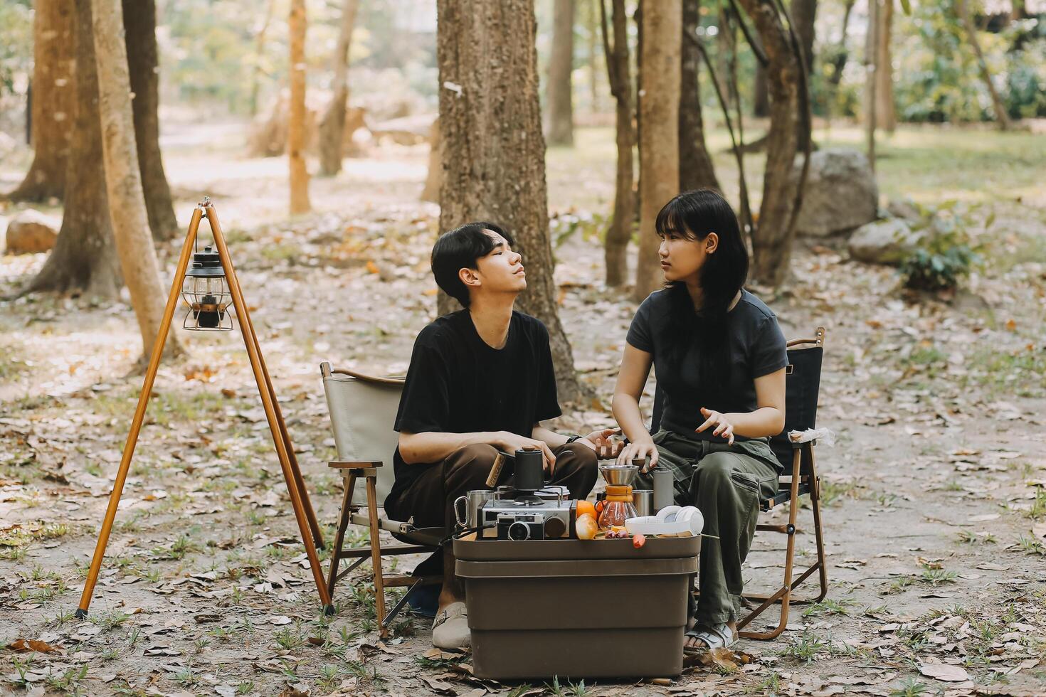 Asian couple sweet in tent inside on they camping trip, traveller relax and sleep togather in out door and camping trip photo