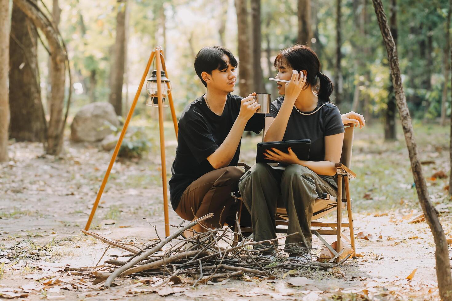 Asian couple sweet in tent inside on they camping trip, traveller relax and sleep togather in out door and camping trip photo