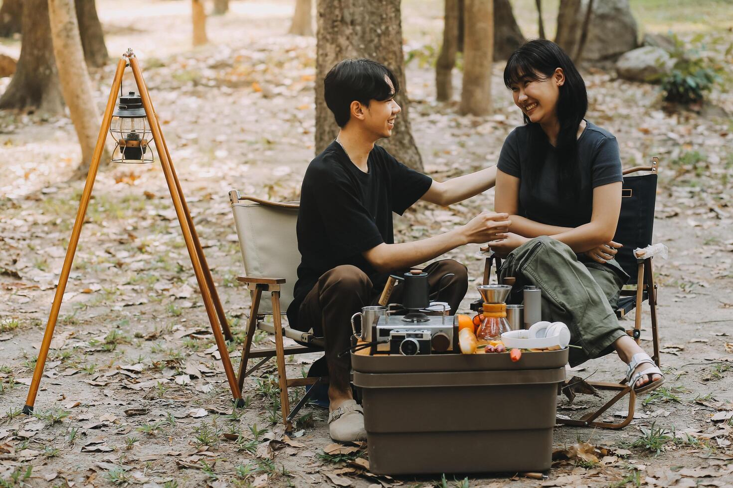 Asian couple sweet in tent inside on they camping trip, traveller relax and sleep togather in out door and camping trip photo