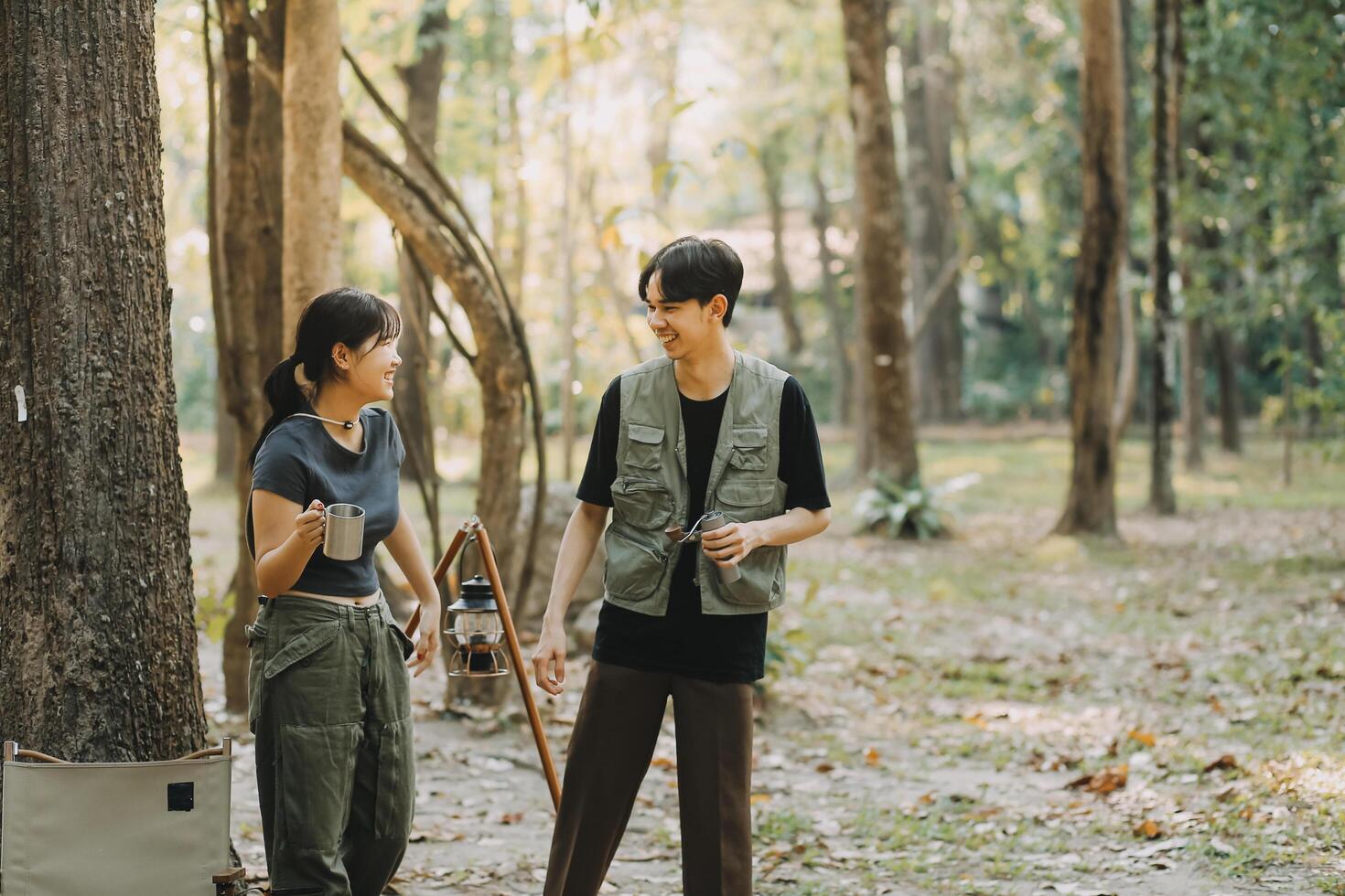Asian couple sweet in tent inside on they camping trip, traveller relax and sleep togather in out door and camping trip photo