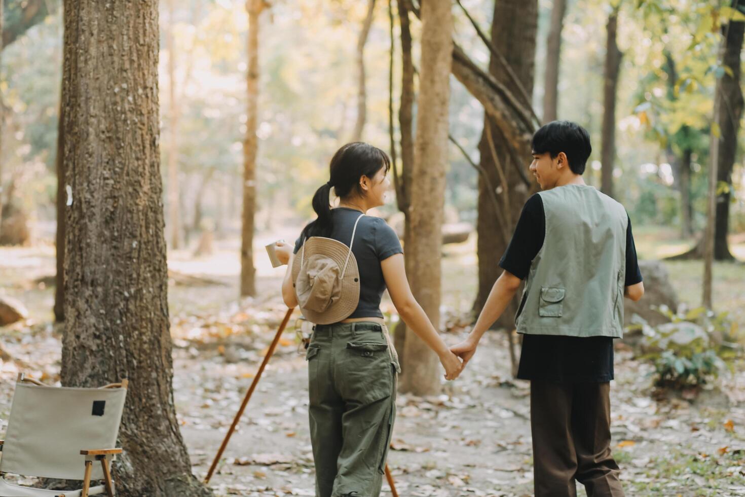 Asian couple sweet in tent inside on they camping trip, traveller relax and sleep togather in out door and camping trip photo
