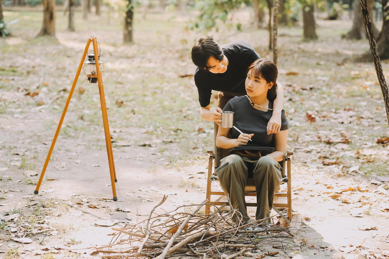 Asian couple sweet in tent inside on they camping trip, traveller relax and sleep togather in out door and camping trip photo