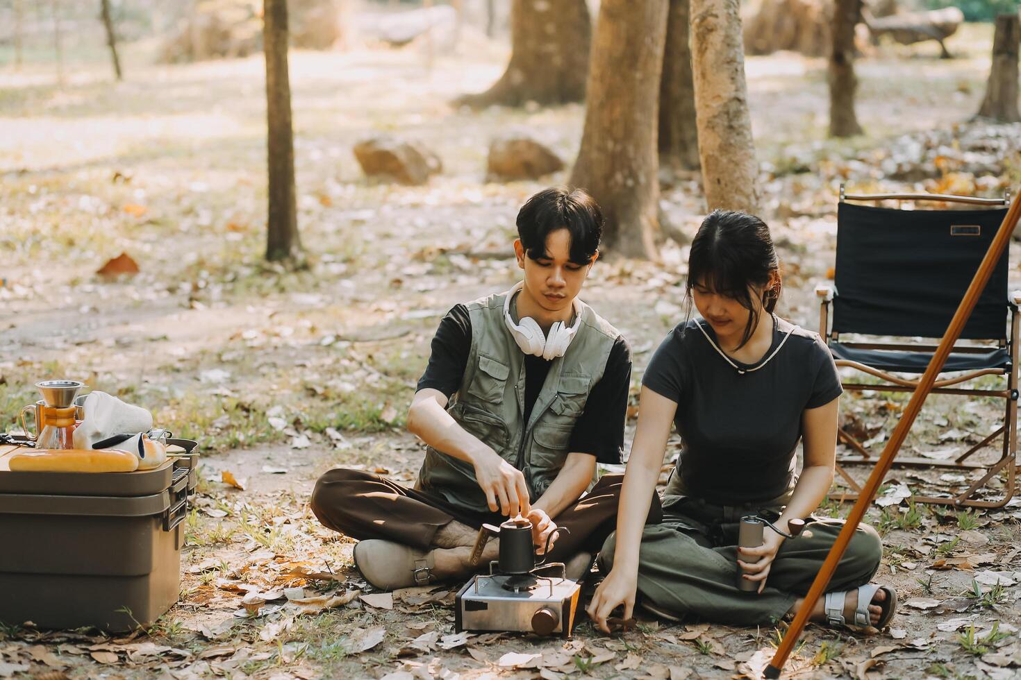 Asian couple sweet in tent inside on they camping trip, traveller relax and sleep togather in out door and camping trip photo