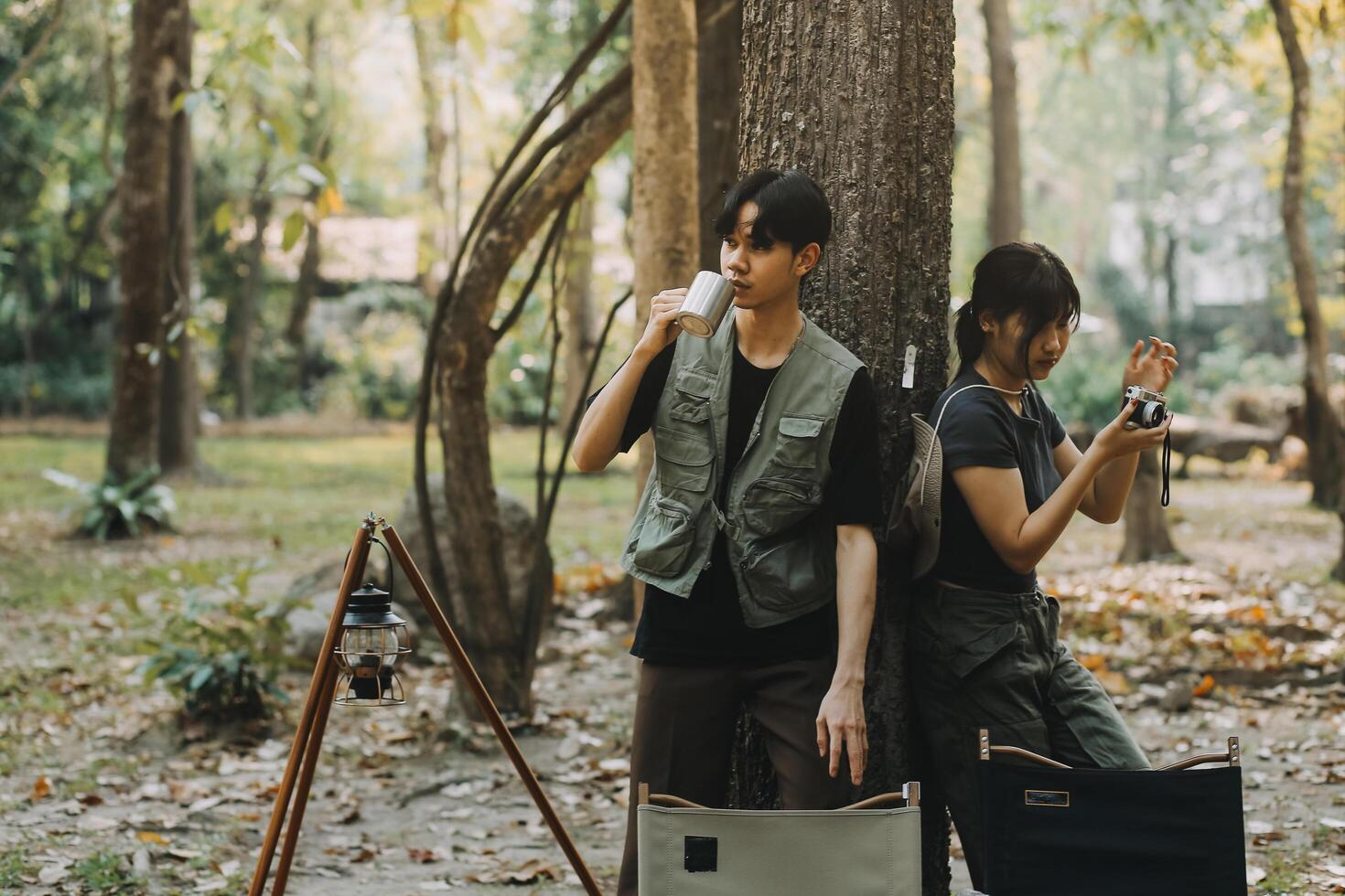 Asian couple sweet in tent inside on they camping trip, traveller relax and sleep togather in out door and camping trip photo