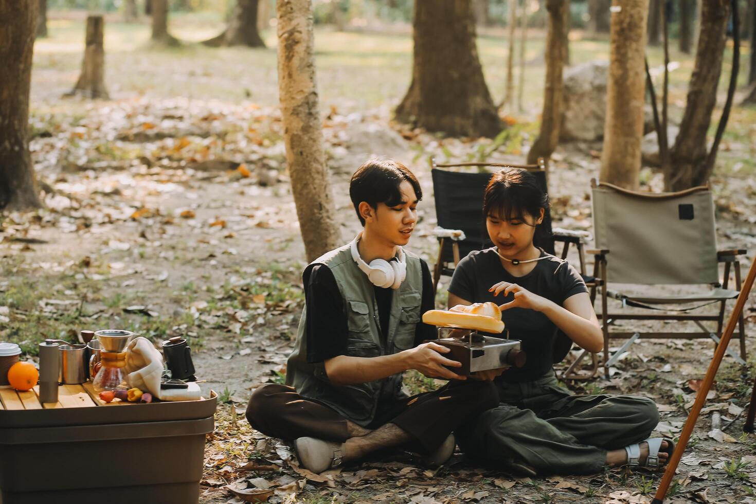 Asian couple sweet in tent inside on they camping trip, traveller relax and sleep togather in out door and camping trip photo