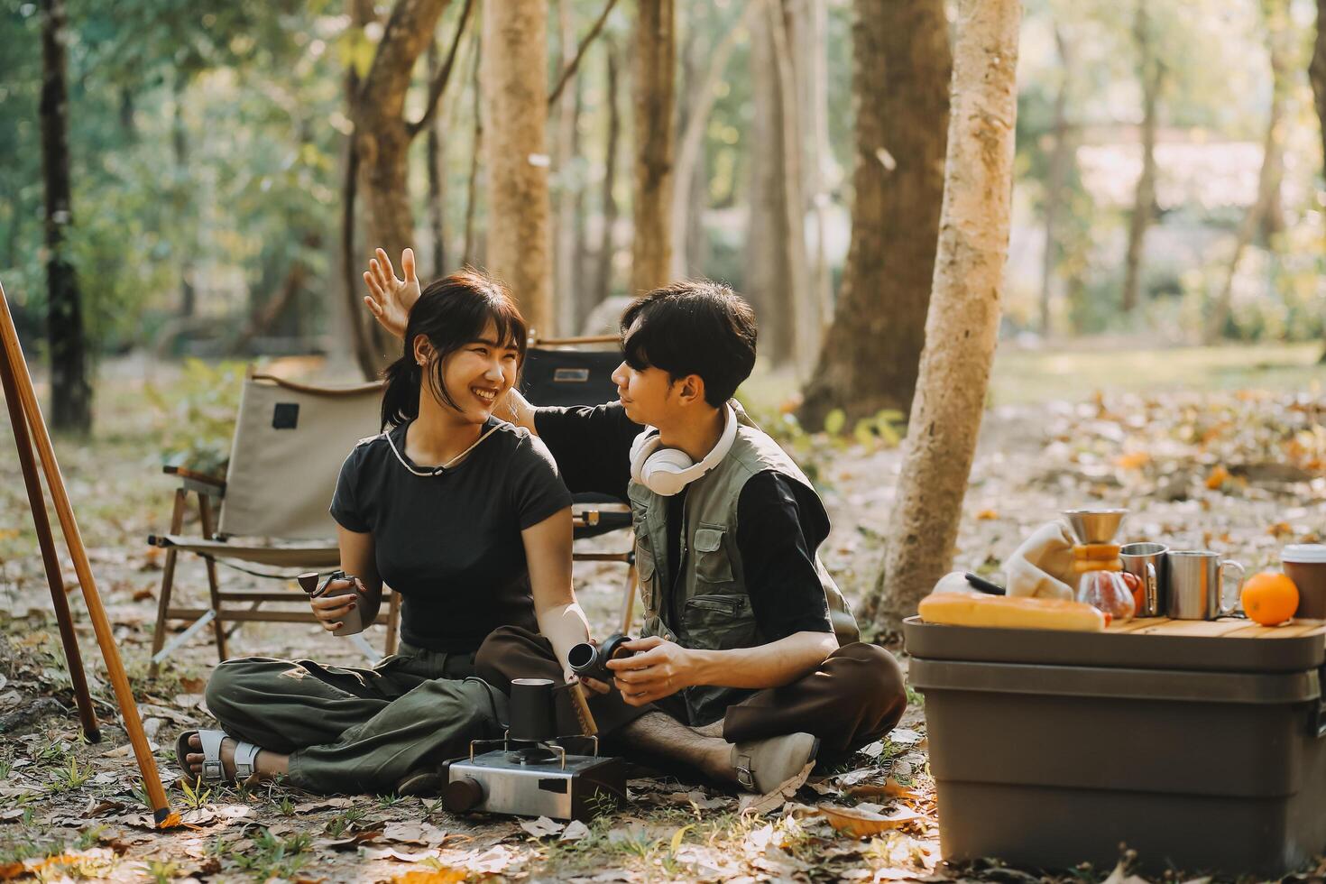 Asian couple sweet in tent inside on they camping trip, traveller relax and sleep togather in out door and camping trip photo
