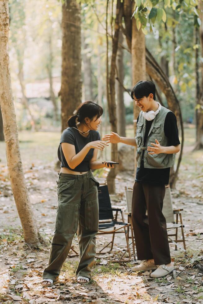 Asian couple sweet in tent inside on they camping trip, traveller relax and sleep togather in out door and camping trip photo