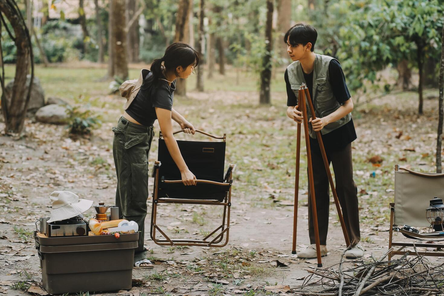 Asian couple sweet in tent inside on they camping trip, traveller relax and sleep togather in out door and camping trip photo