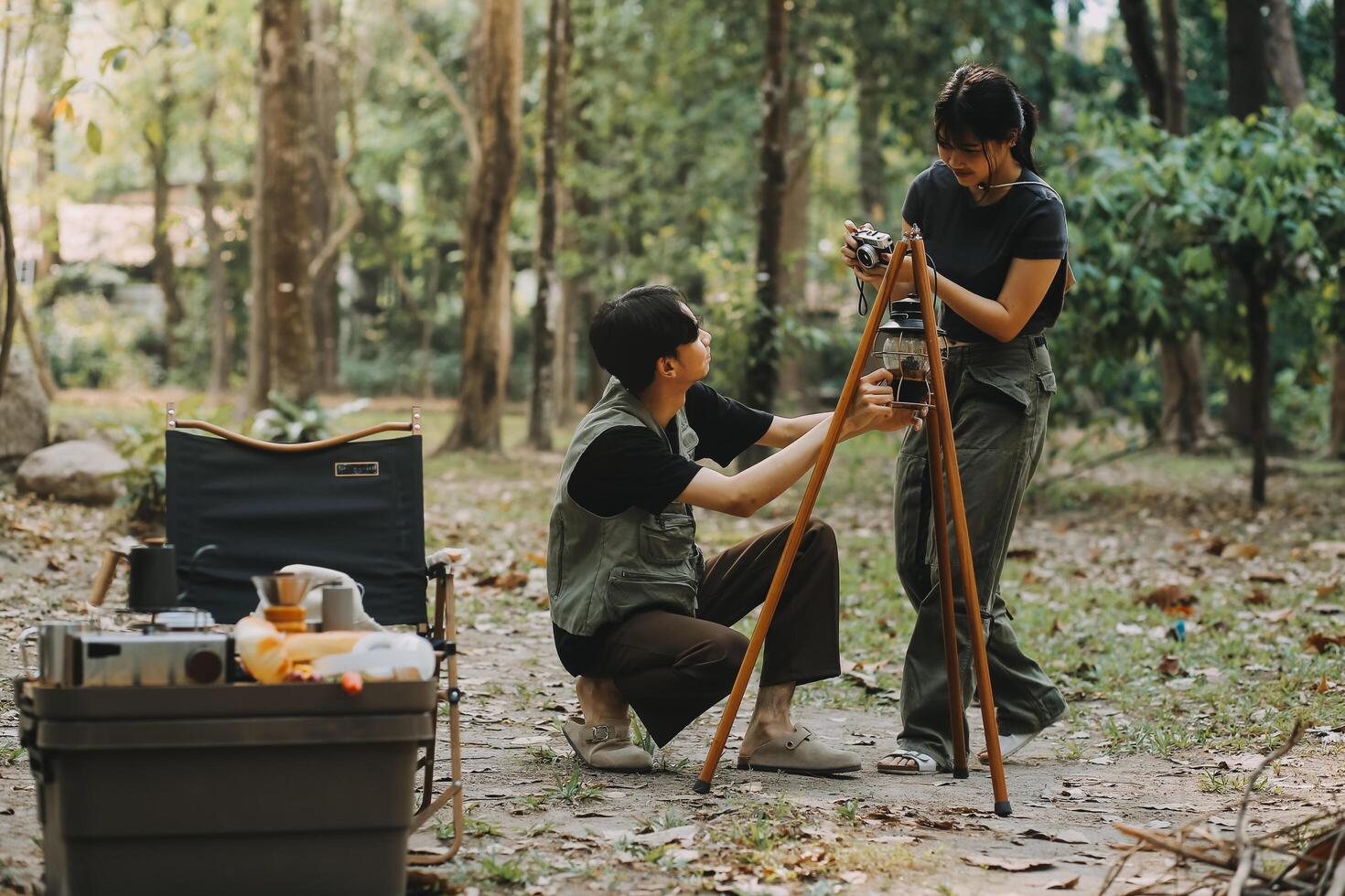 Asian couple sweet in tent inside on they camping trip, traveller relax and sleep togather in out door and camping trip photo