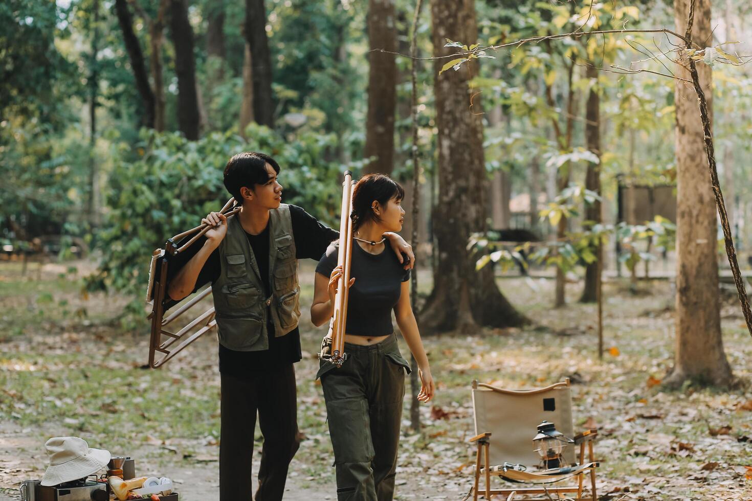 Asian couple sweet in tent inside on they camping trip, traveller relax and sleep togather in out door and camping trip photo
