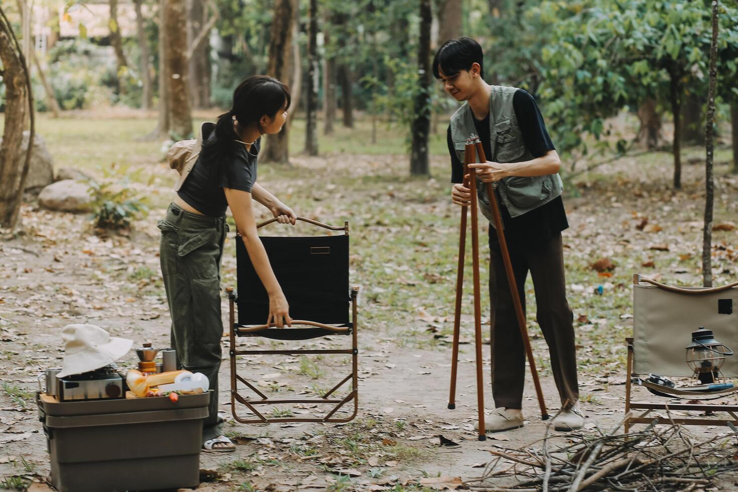 Asian couple sweet in tent inside on they camping trip, traveller relax and sleep togather in out door and camping trip photo