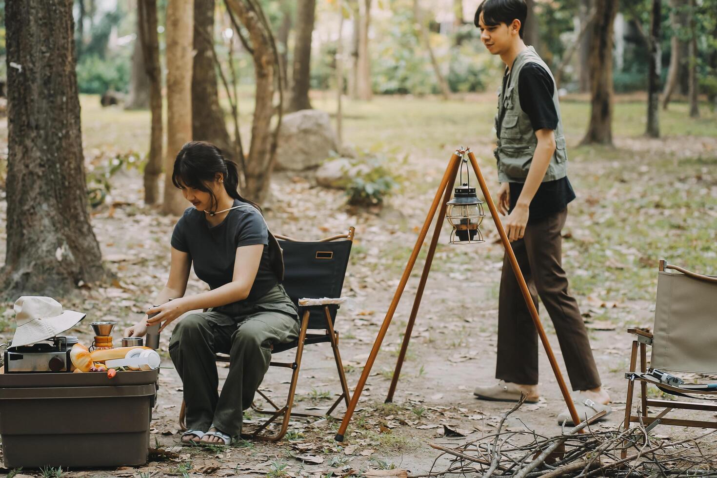 Asian couple sweet in tent inside on they camping trip, traveller relax and sleep togather in out door and camping trip photo