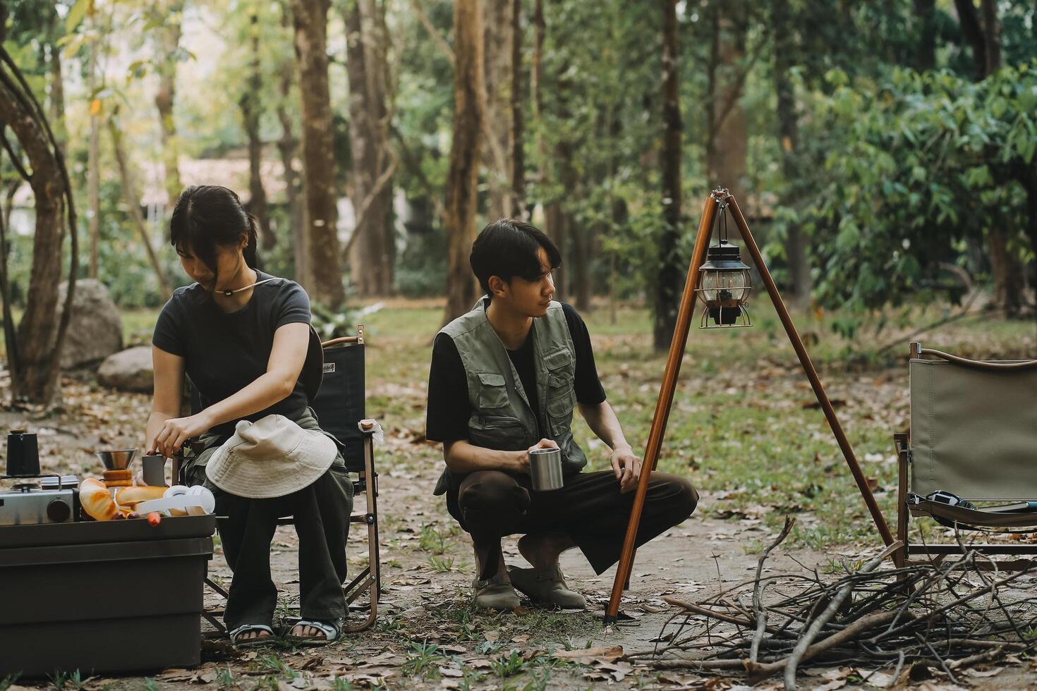 Asian couple sweet in tent inside on they camping trip, traveller relax and sleep togather in out door and camping trip photo