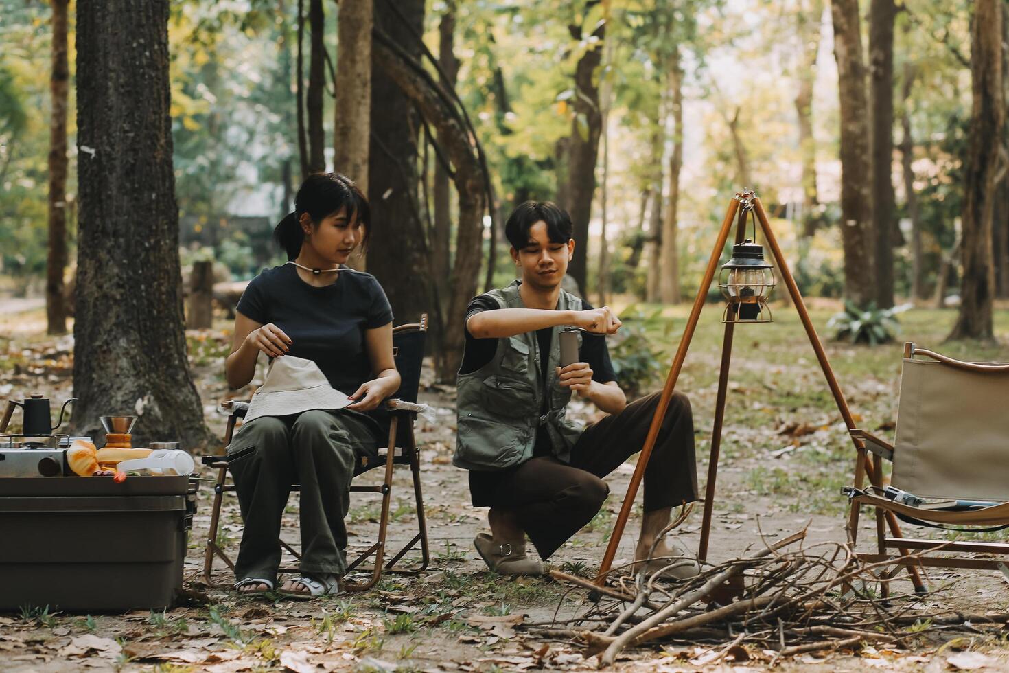 Asian couple sweet in tent inside on they camping trip, traveller relax and sleep togather in out door and camping trip photo