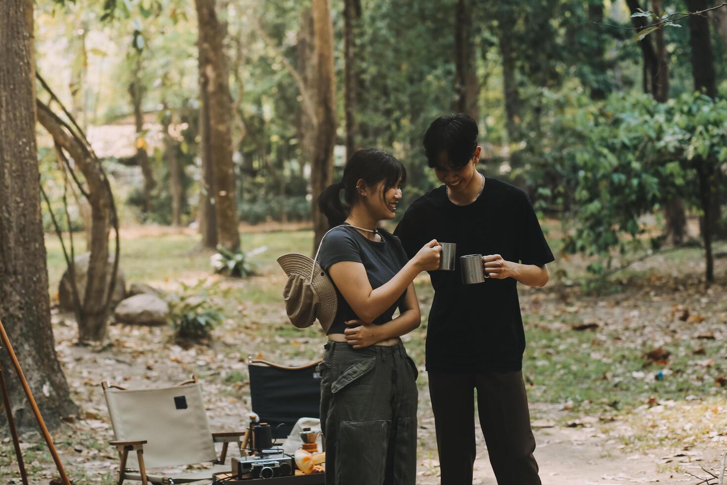 Asian couple sweet in tent inside on they camping trip, traveller relax and sleep togather in out door and camping trip photo