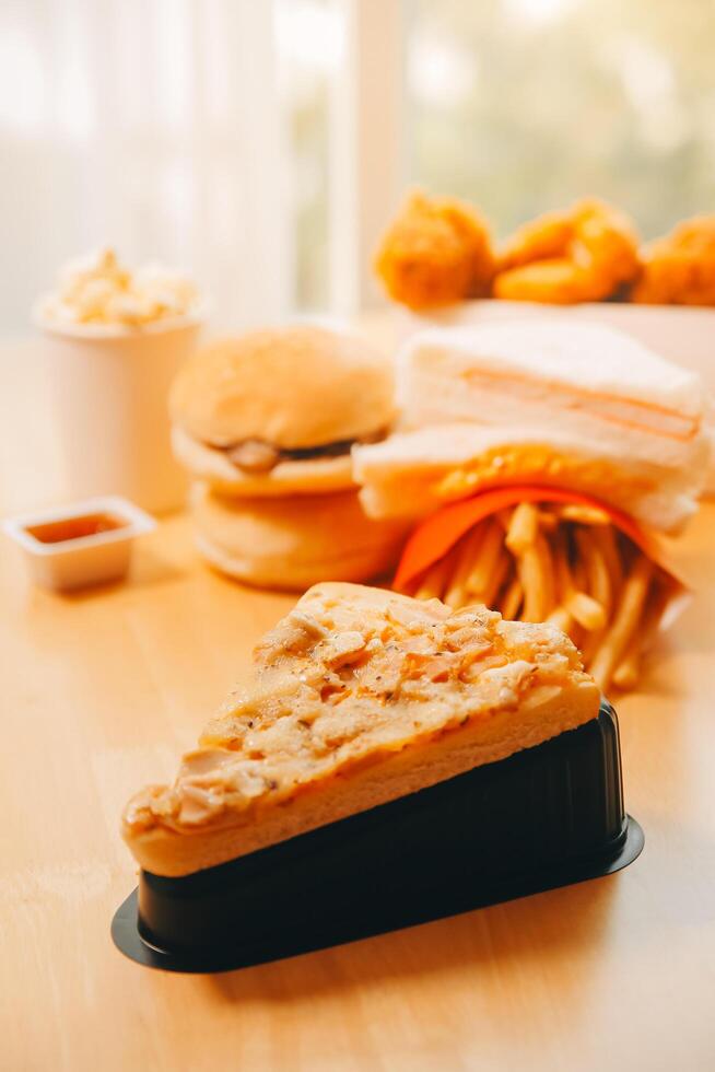Multiple type of Fast food on table. photo