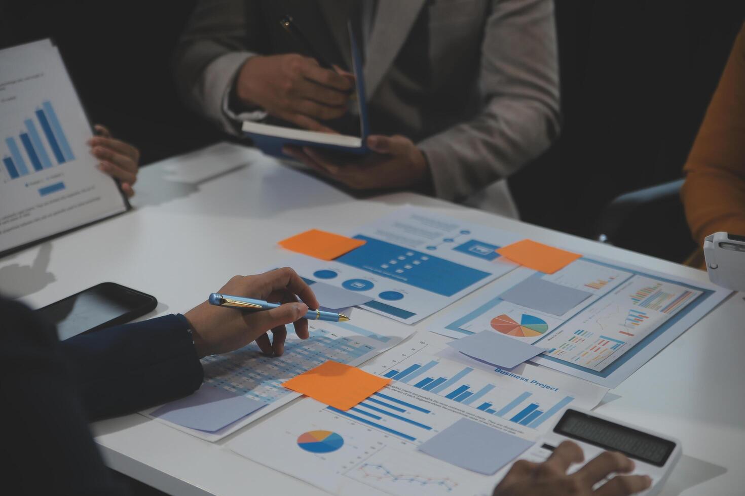Business team collaboration discussing working analyzing with financial data and marketing growth report graph in team, presentation and brainstorming to strategy planning making profit of company. photo