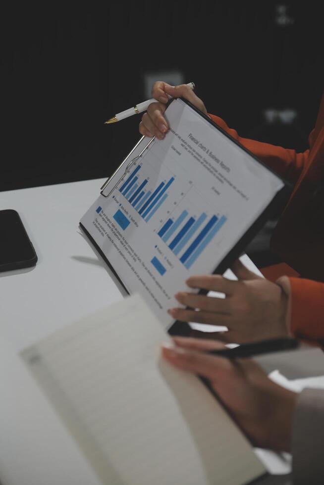 Business team collaboration discussing working analyzing with financial data and marketing growth report graph in team, presentation and brainstorming to strategy planning making profit of company. photo