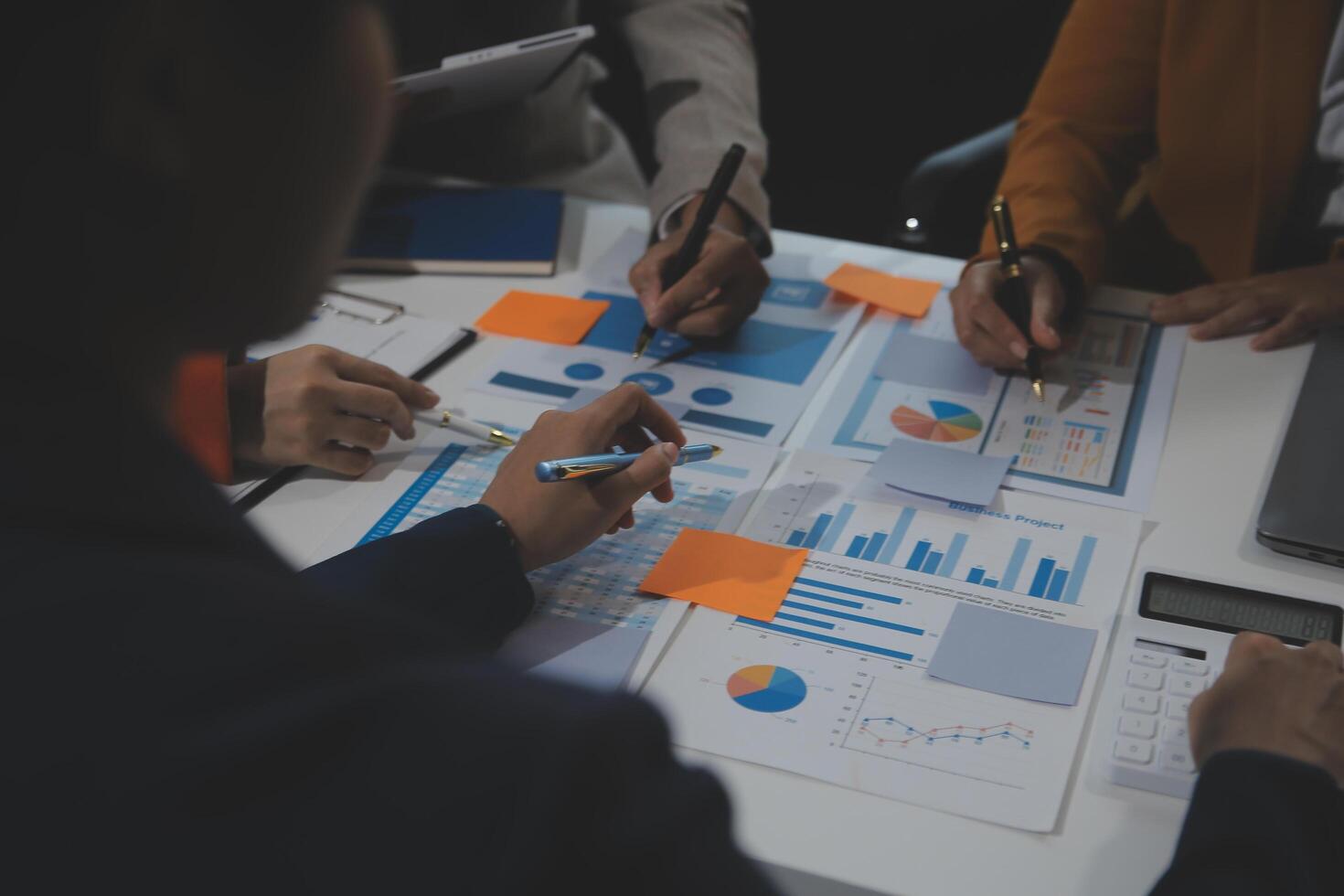 Business team collaboration discussing working analyzing with financial data and marketing growth report graph in team, presentation and brainstorming to strategy planning making profit of company. photo