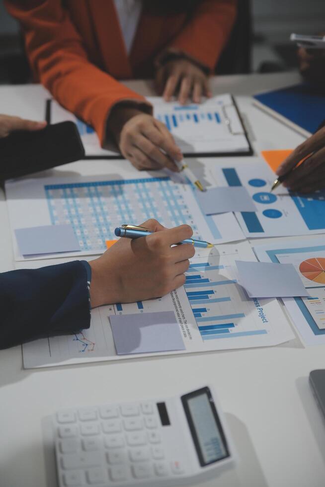 Business team collaboration discussing working analyzing with financial data and marketing growth report graph in team, presentation and brainstorming to strategy planning making profit of company. photo