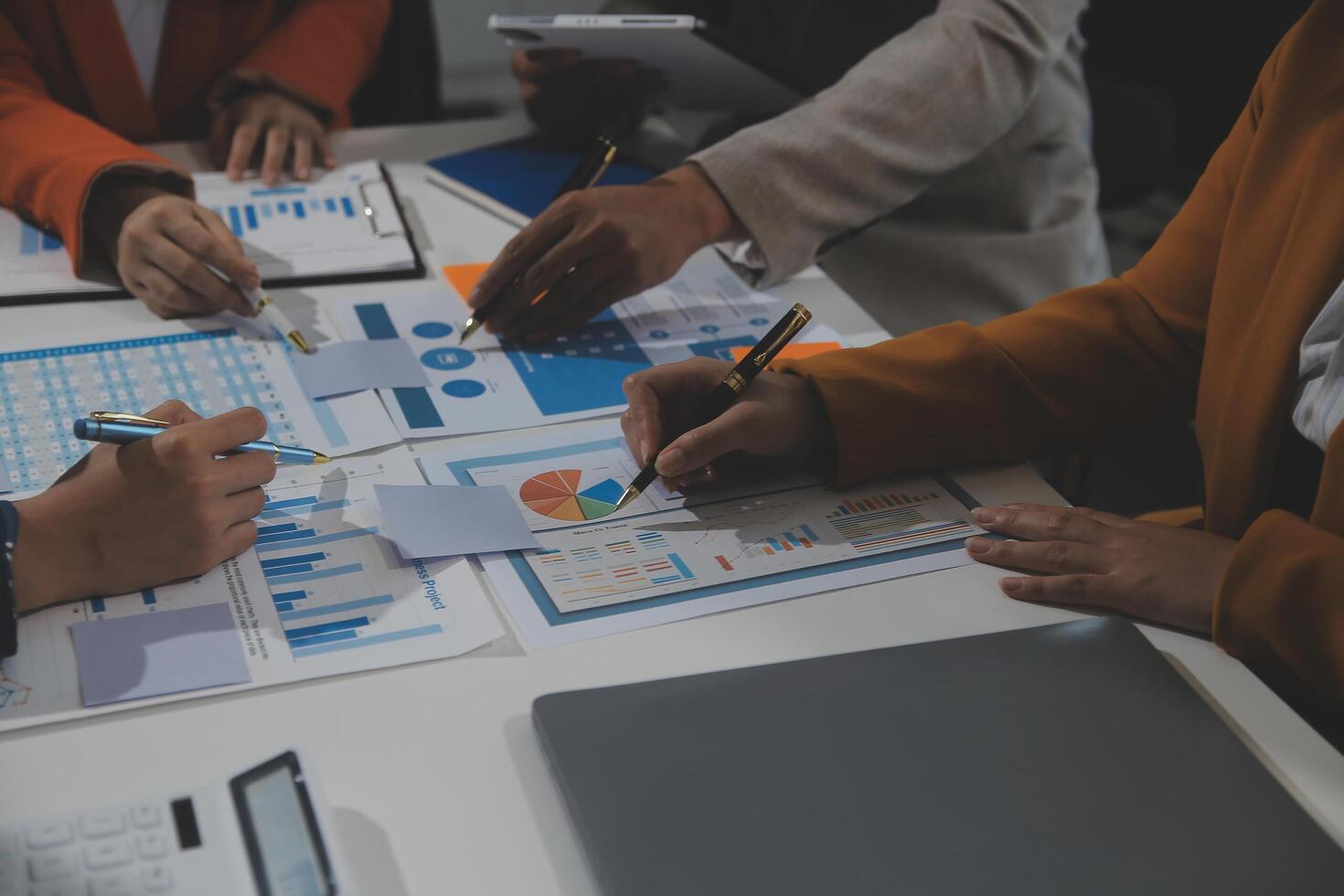 Business team collaboration discussing working analyzing with financial data and marketing growth report graph in team, presentation and brainstorming to strategy planning making profit of company. photo