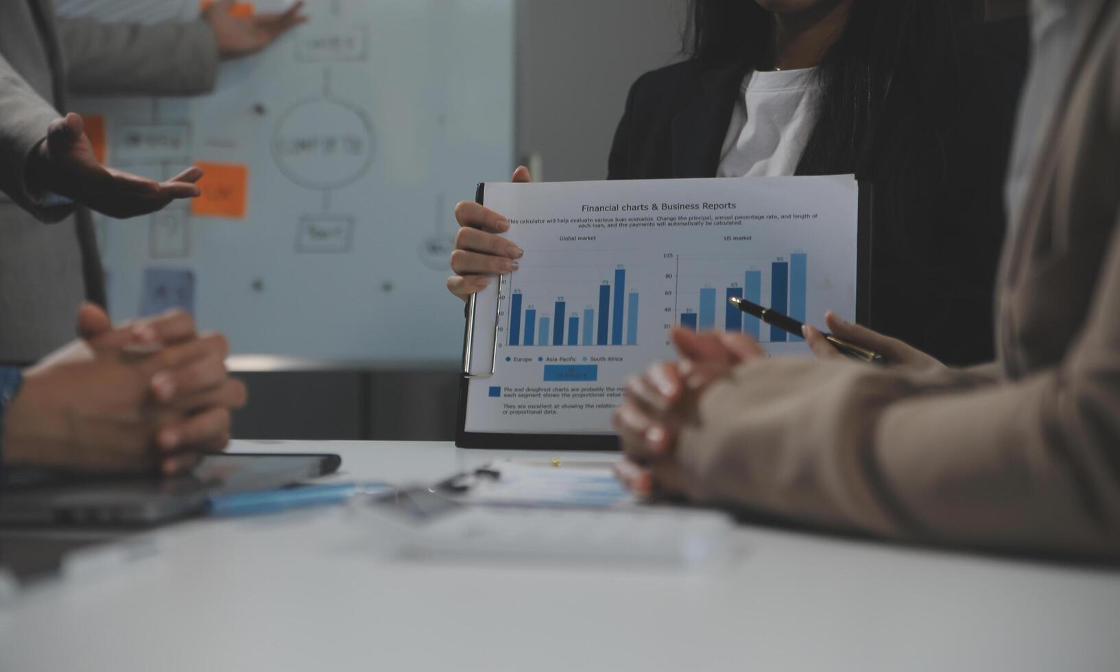 Business team collaboration discussing working analyzing with financial data and marketing growth report graph in team, presentation and brainstorming to strategy planning making profit of company. photo