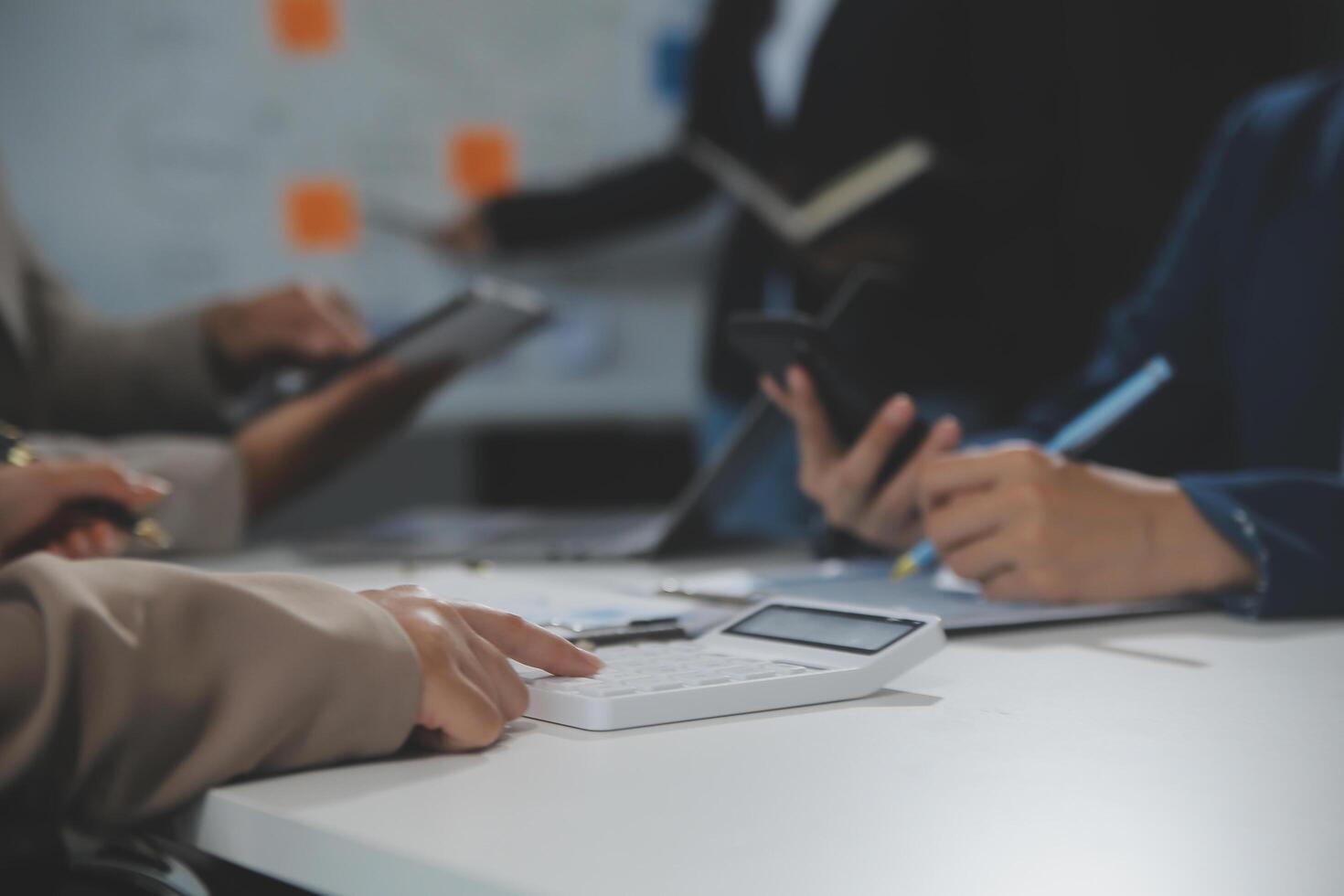 Business team collaboration discussing working analyzing with financial data and marketing growth report graph in team, presentation and brainstorming to strategy planning making profit of company. photo