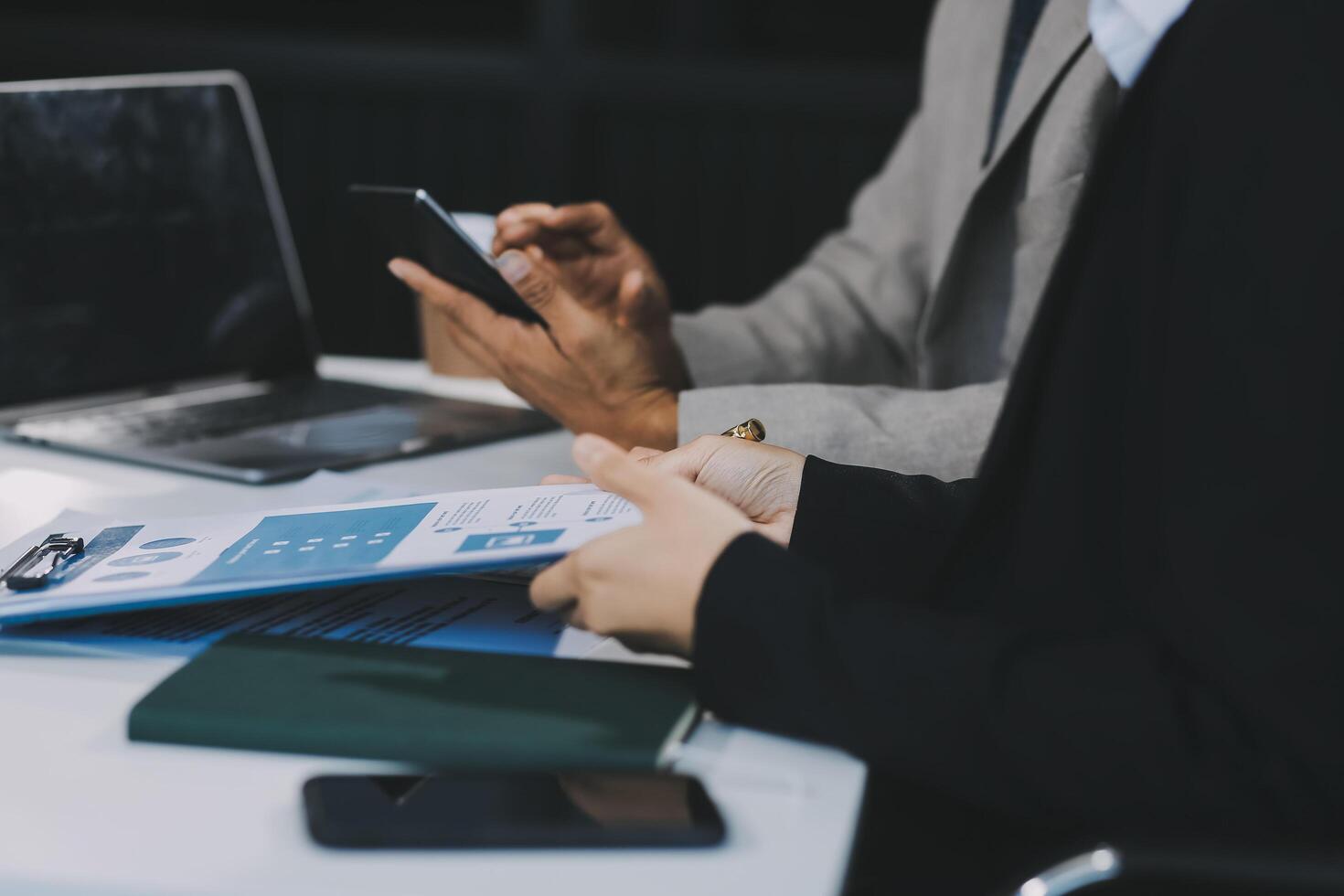 Business team present. Business man hands hold documents with financial statistic stock photo, discussion, and analysis report data the charts and graphs. Finance concept photo
