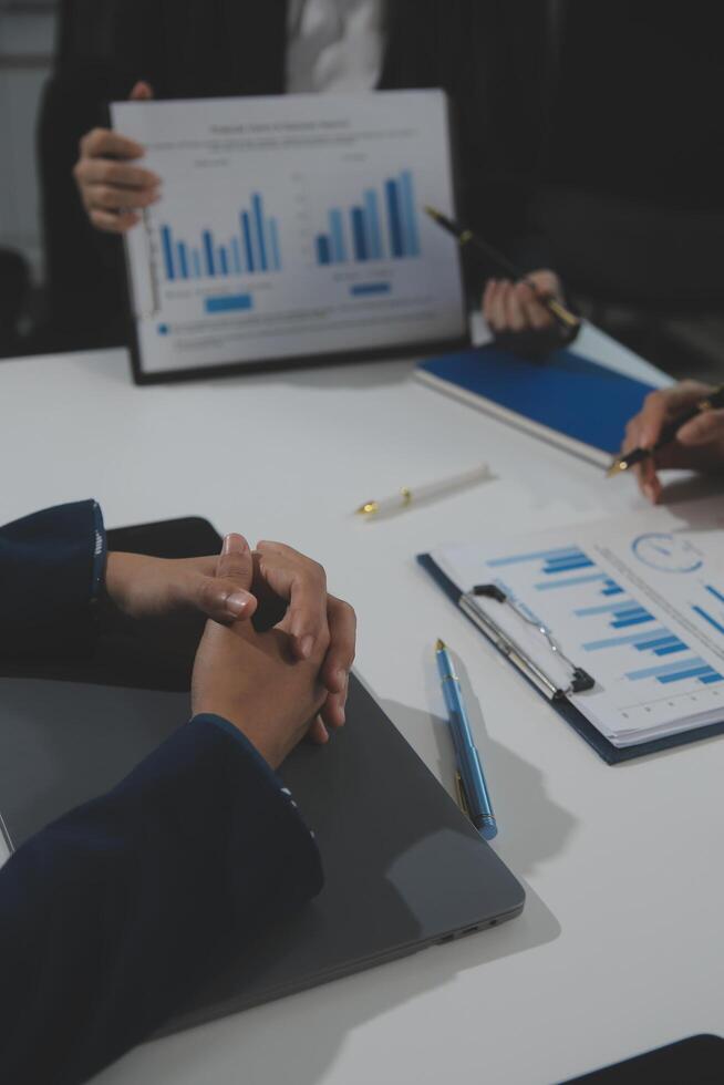 Business team collaboration discussing working analyzing with financial data and marketing growth report graph in team, presentation and brainstorming to strategy planning making profit of company. photo