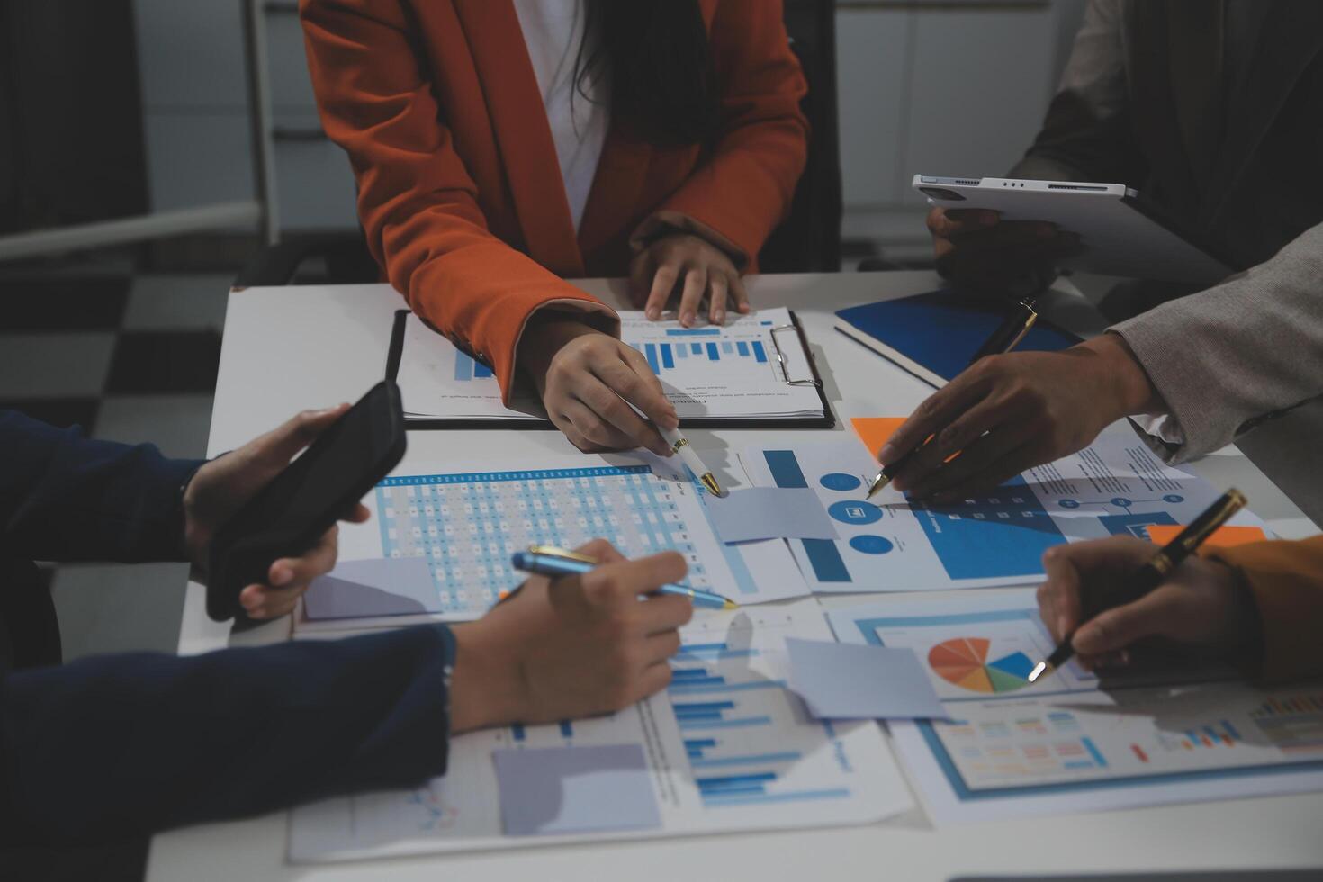 Business team collaboration discussing working analyzing with financial data and marketing growth report graph in team, presentation and brainstorming to strategy planning making profit of company. photo