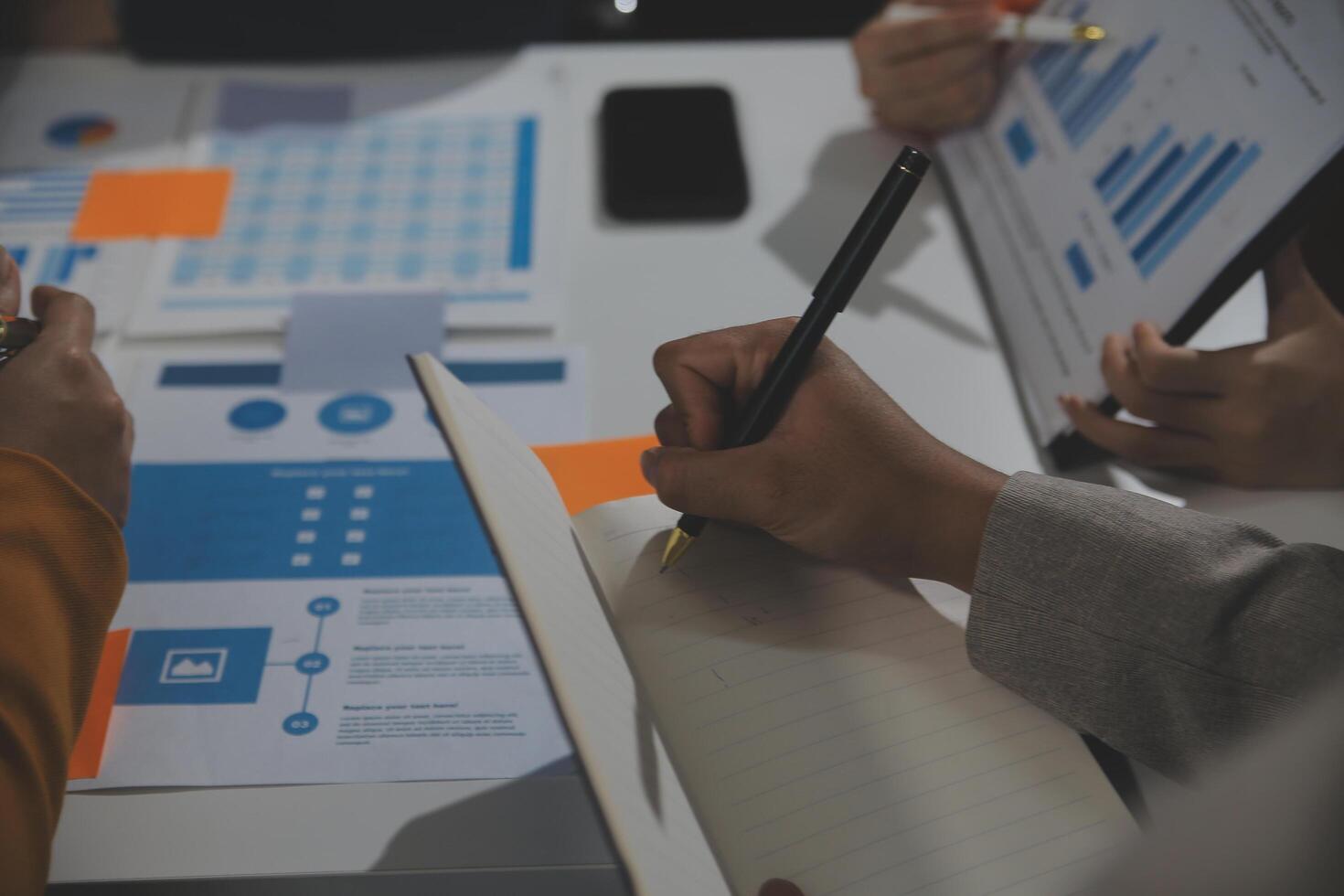 Business team collaboration discussing working analyzing with financial data and marketing growth report graph in team, presentation and brainstorming to strategy planning making profit of company. photo