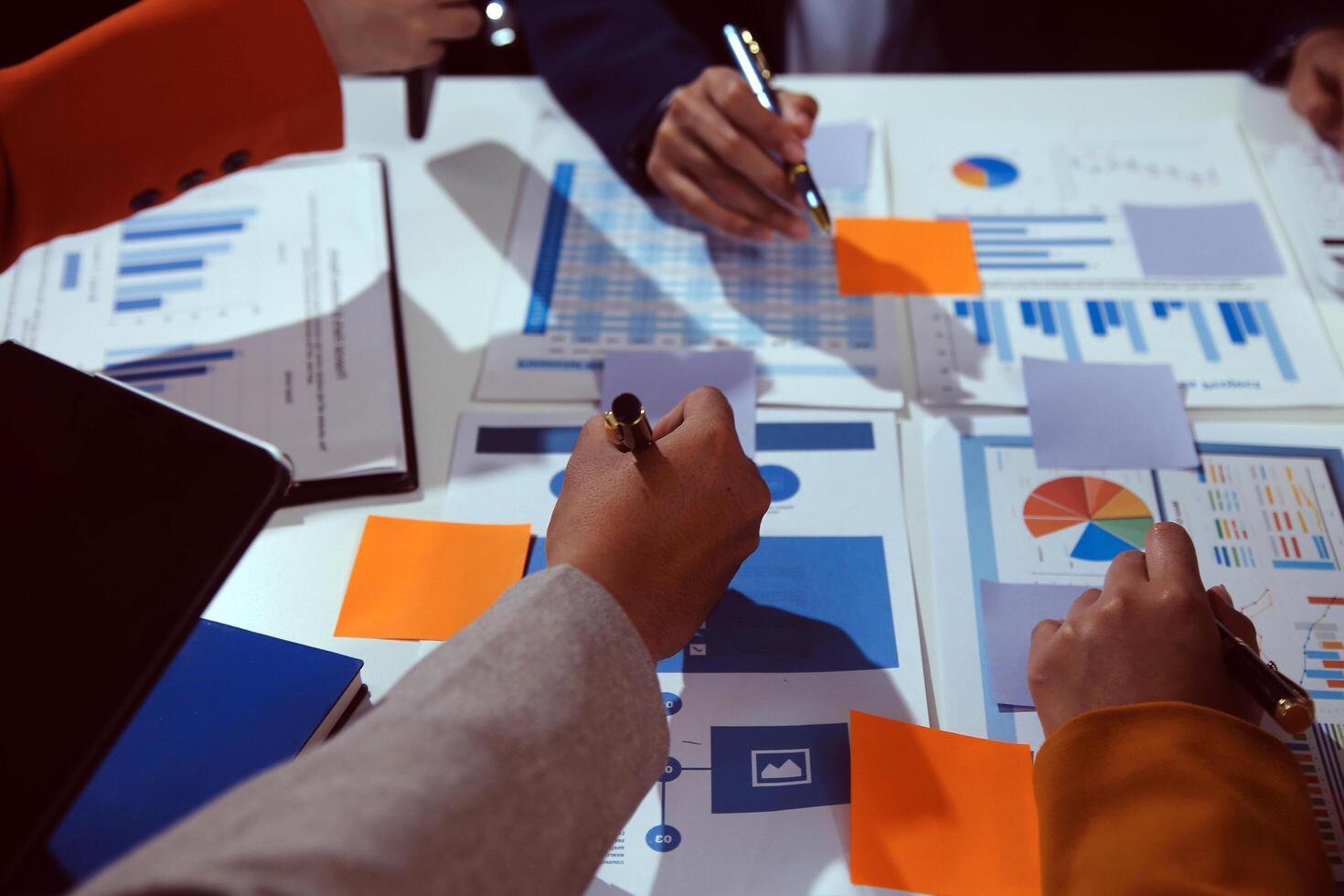 Business team collaboration discussing working analyzing with financial data and marketing growth report graph in team, presentation and brainstorming to strategy planning making profit of company. photo